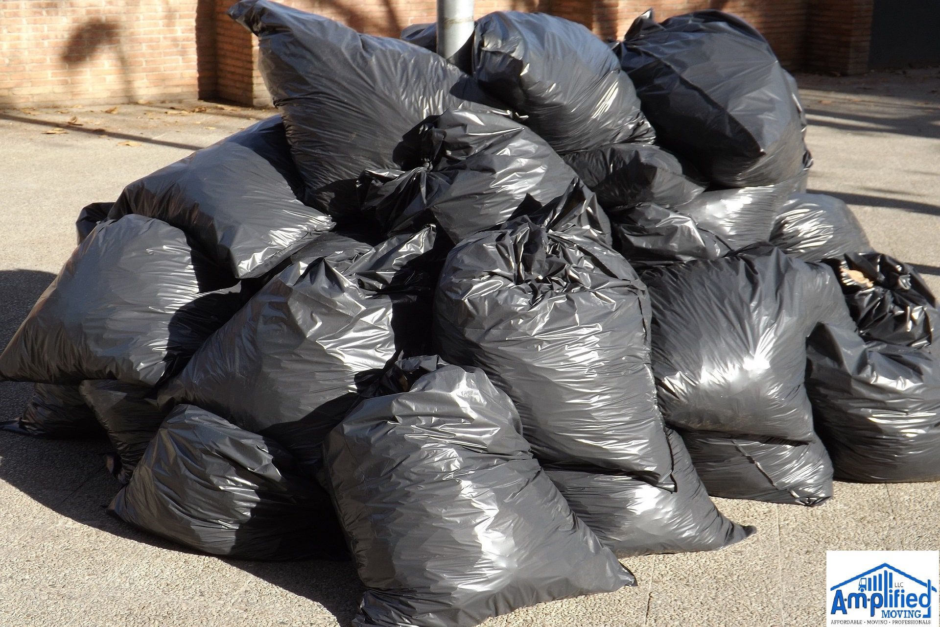 Big plastic black bags near the street.