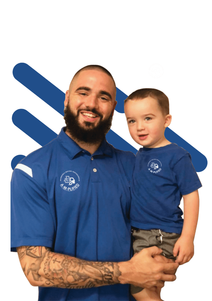 Man holding a child, both wearing amplified moving blue shirts and happy