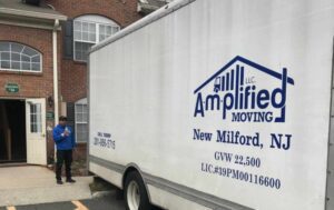 Truck with amplified moving logo parking in front of a building