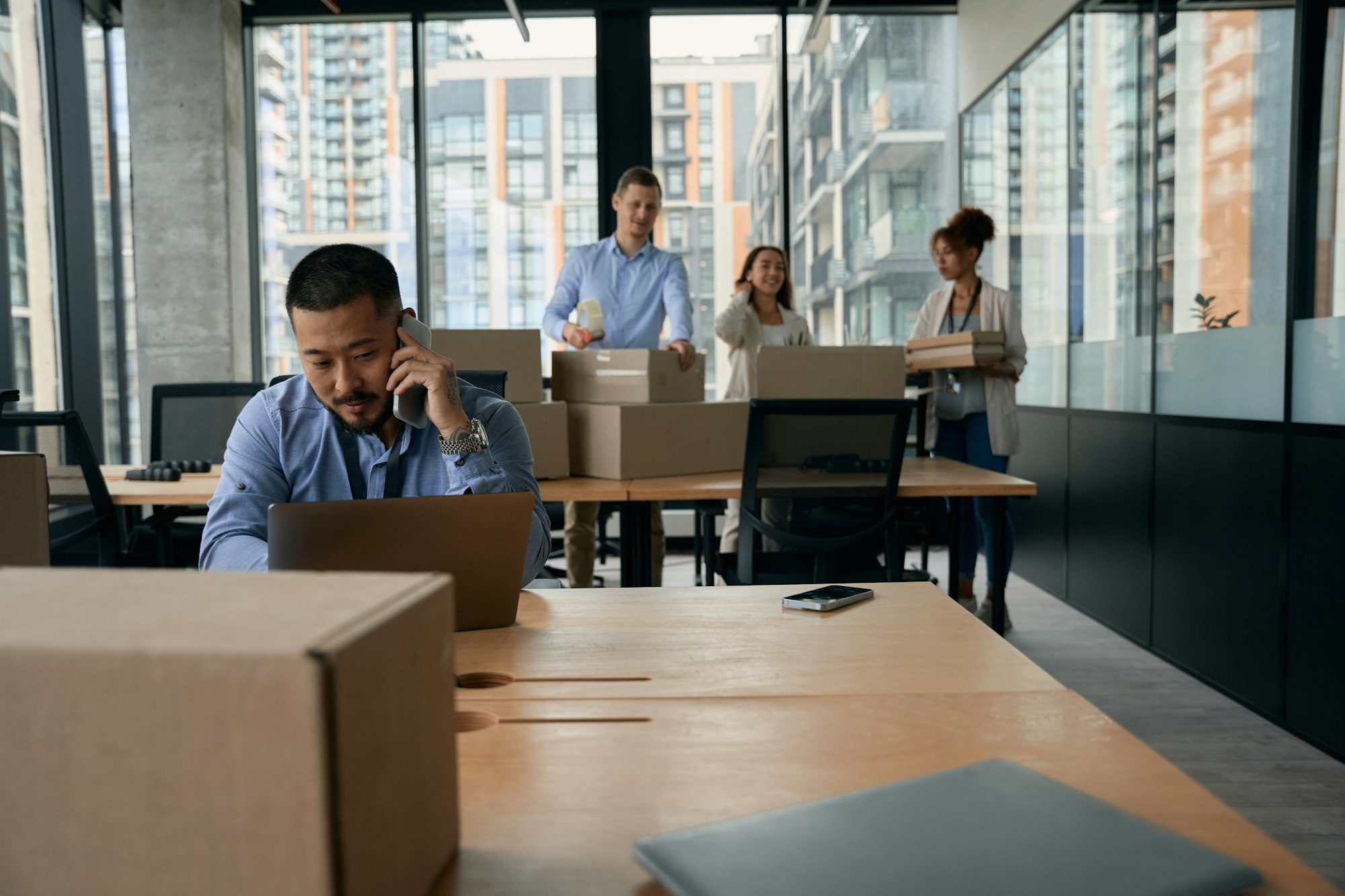 Team of corporate employees preparing for office move